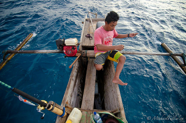 Fishing with Aka in his outrigger canoe.