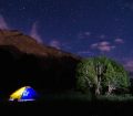 Camping at a river delta in the Pamir Mountains, inside a leaky $20 tent we named 'Oliver'.