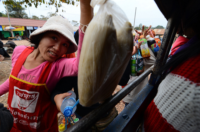 Woman selling corn in Laos